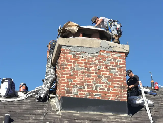 Pickerington Chimney Sweep installing a custom chimney crown in Pickerington, OH
