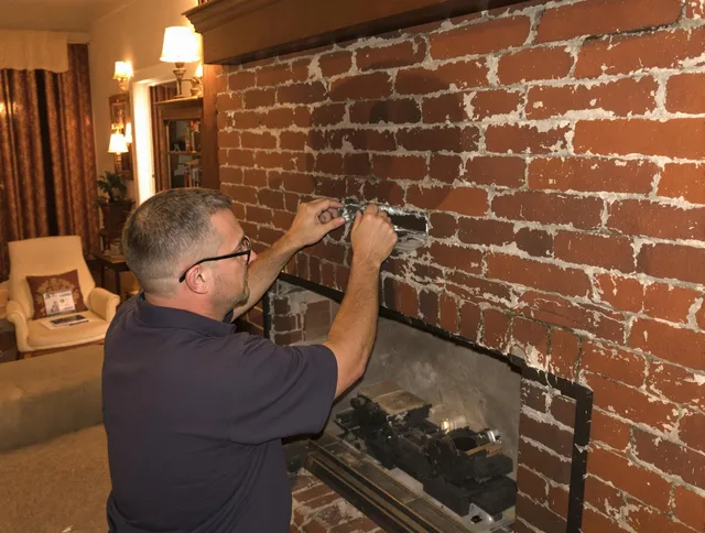 Pickerington Chimney Sweep expert fixing a fireplace in Pickerington, OH